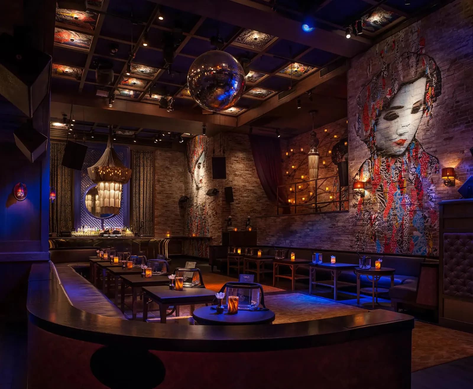 VIP booths and tables under a mirror ball at TAO Downtown, a 1990 Group venue in New York.